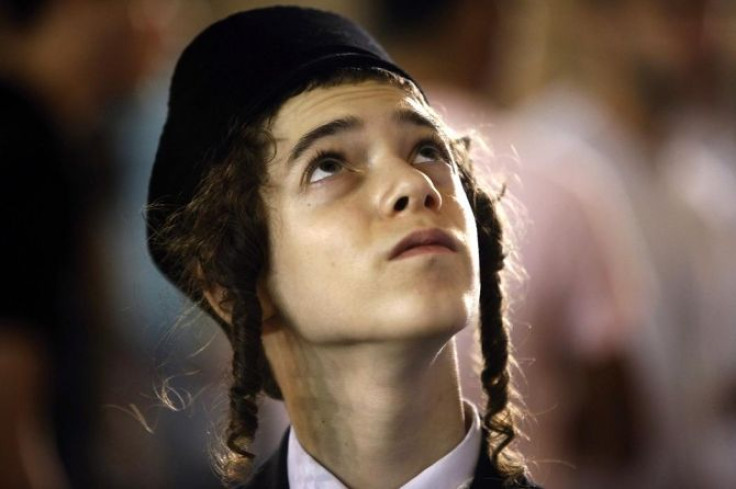 A Jewish worshipper is seen during prayers marking Tisha B'Av near the Western Wall in Jerusalem July 20, 2010.