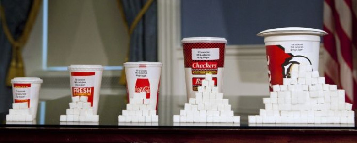 Soft drink cups of various sizes are displayed at a news conference at City Hall in New York