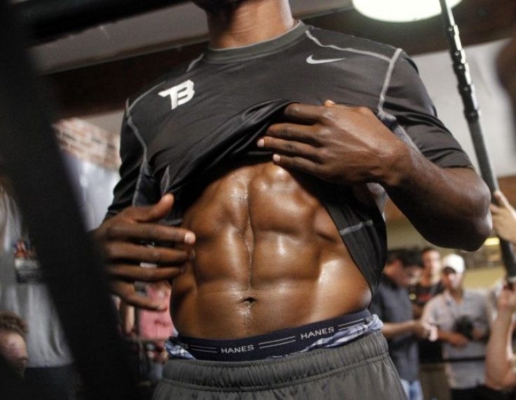 world junior welterweight champion Timothy Bradley shows his abdominal muscles