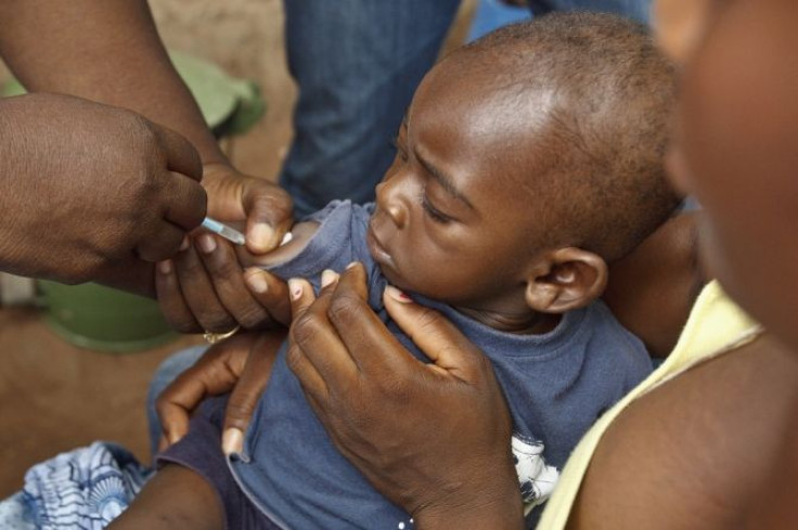 A boy is vaccinated against measles as part of a vaccination programme at the Dodowa new town health outreach point in Dodowa, April 25, 2012. In 2008, the last year for which full data is available, more than 54,000 Ghanian children died before they had