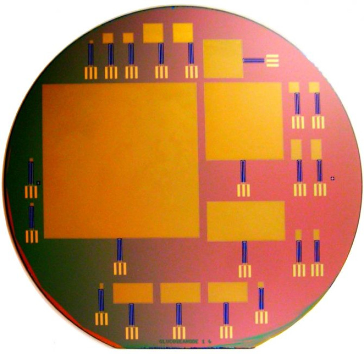This silicon wafer consists of glucose fuel cells of varying sizes; the largest is 64 by 64 mm.