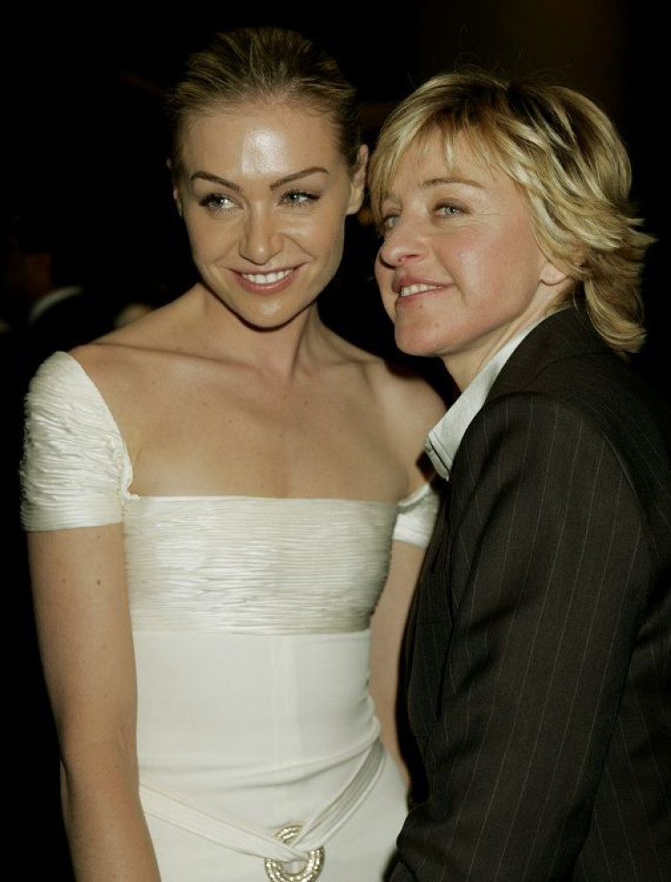 Talk show host Ellen DeGeneres (R) and her wife Portia DeRossi pose as they move from one party to another after the 62nd annual Golden Globe Awards in Beverly Hills, California January 16, 2005.