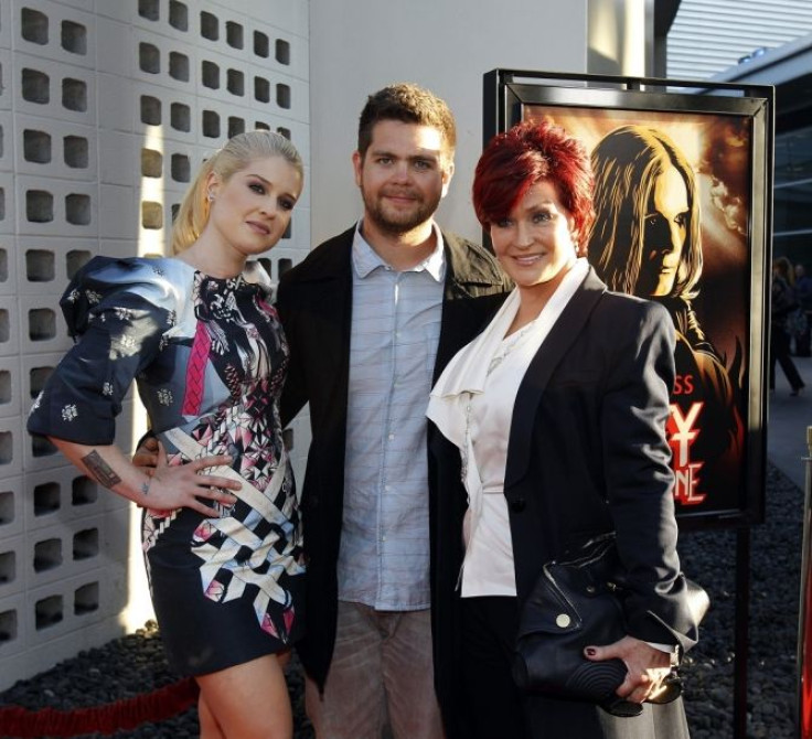 Jack Osbourne (C) poses with his mother Sharon Osbourne (R) and his sister Kelly Osbourne at a private preview of the documentary &quot;God Bless Ozzy Osbourne&quot; at the Arclight Cinerama Dome in Hollywood, California August 22, 2011