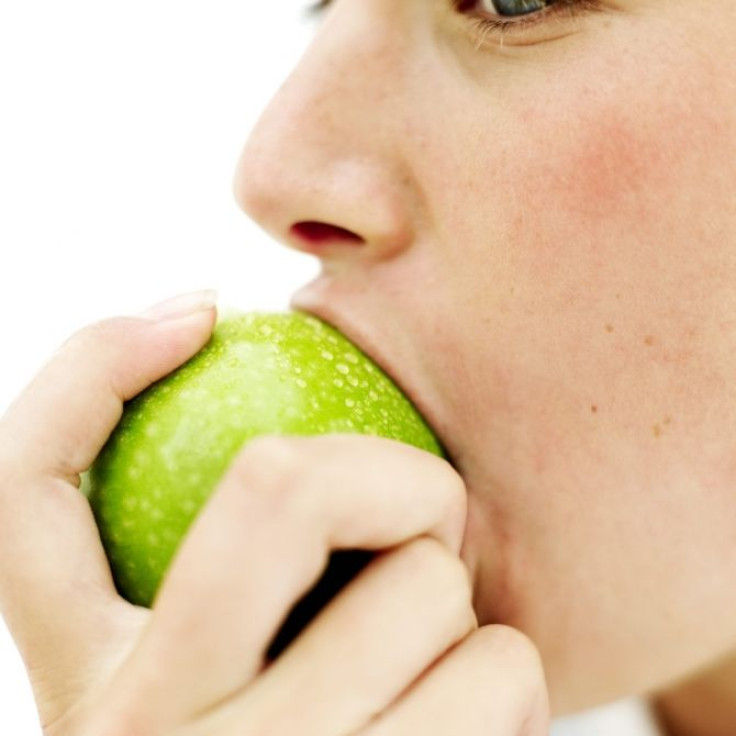 woman eating fruit