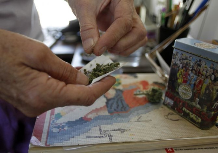 An activist for the legalization of marijuana, who declined to be identified, rolls a marijuana cigarette in a neighbourhood of Montevideo.