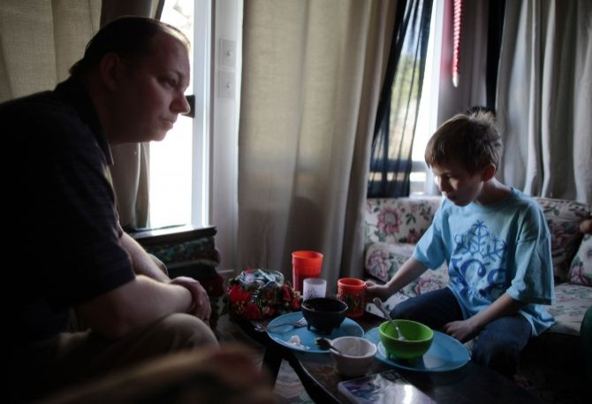 father and son eating