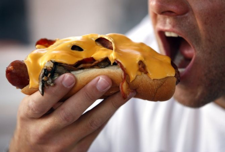 man eating hot dog