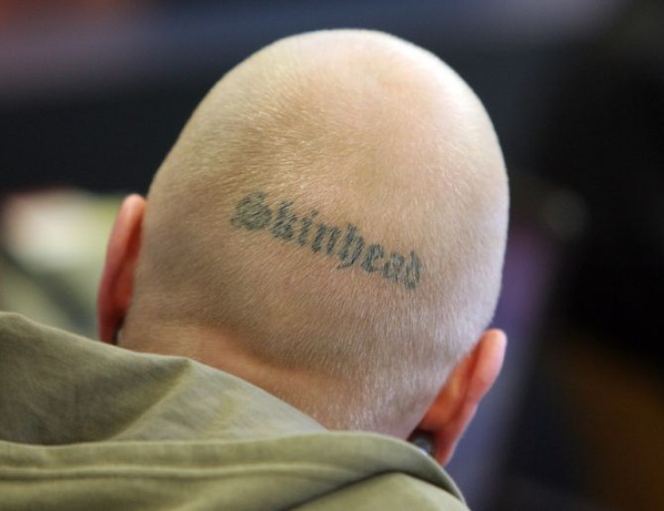 The back of the head of defendant Tom W. with the word 'Skinhead' tattooed on his scalp is pictured as he awaits the start of a trial in a courtroom in Dresden April 10, 2008. Five members of German far-right extremist brotherhood 'Storm 34' are accus