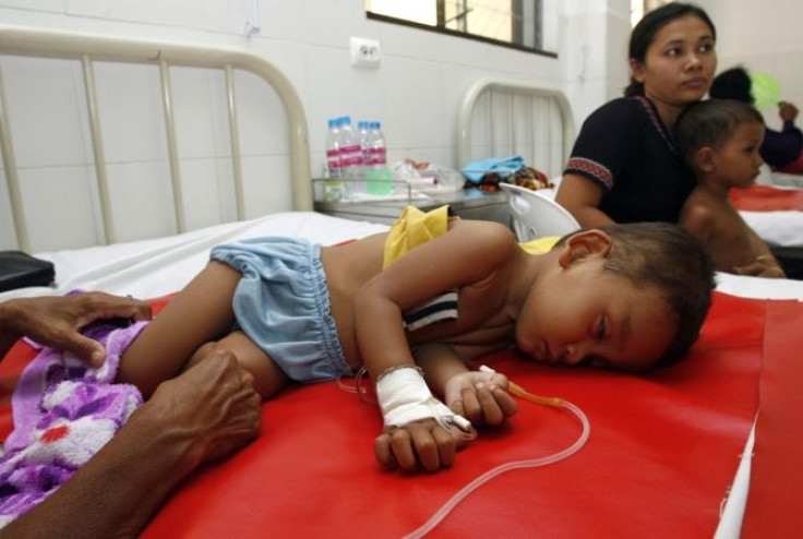 A child suffering from Dengue fever lies on a bed at Kantha Bopha hospital Phnom Penh in this June 18, 2007 file photo.