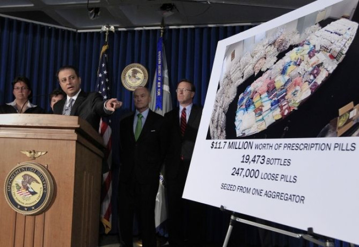 Preet Bharara, U.S. Attorney for the Southern District of New York, speaks as Ray Kelly (2nd R) NYPD Commissioner, and Robert Doar (R), Commissioner of the New York City Human Resources Administration look on during a news conference announcing the unseal