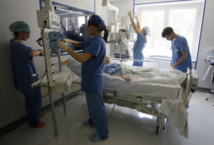 Nurses check a patient in the intensive care unit at the Ambroise Pare hospital in Marseille, southern France, April 8, 2008.