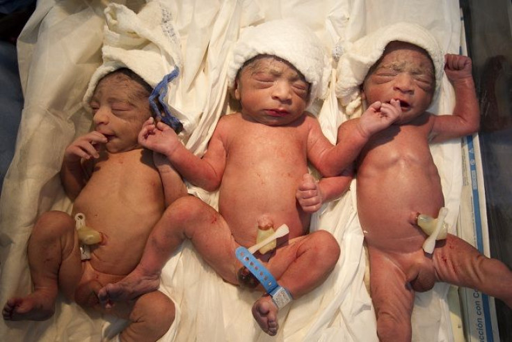 Another Case of Seeing Triple: The newborn triplets of Yojaimi Garcia lie on a trolley minutes after they were born inside the childbirth unit at the Santa Ana public maternity hospital in Caracas.