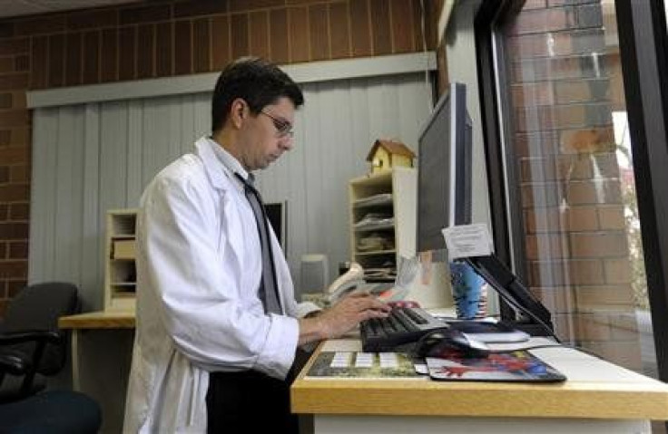 Geisinger Health System pediatrician Dr. James Zolla enters and reviews patient medical information in the Geisinger Health System electronic health records system at the Geisinger Clinic in Selinsgrove, Pennsylvania, October 28, 2009.