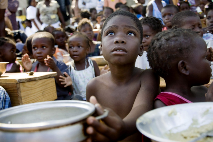 A child awaits for the distribution of meals, hunger