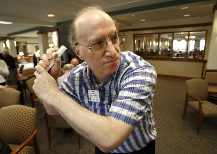 Elderly man playing video games