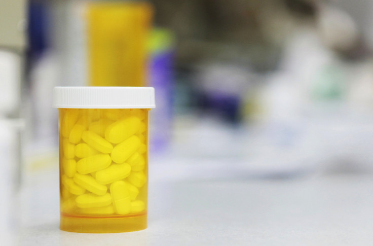 Bottle of prescription medication on counter at pharmacy