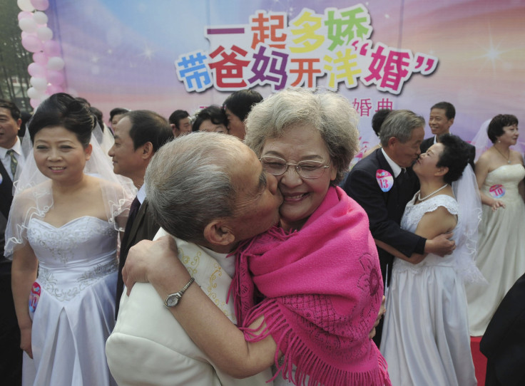 elderly couple kiss