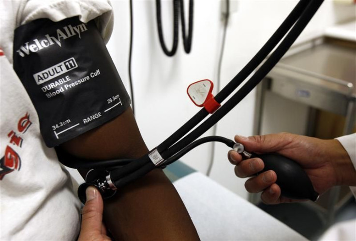 doctor checks  blood pressure of a patient