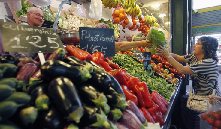 woman buys vegetables, fruits