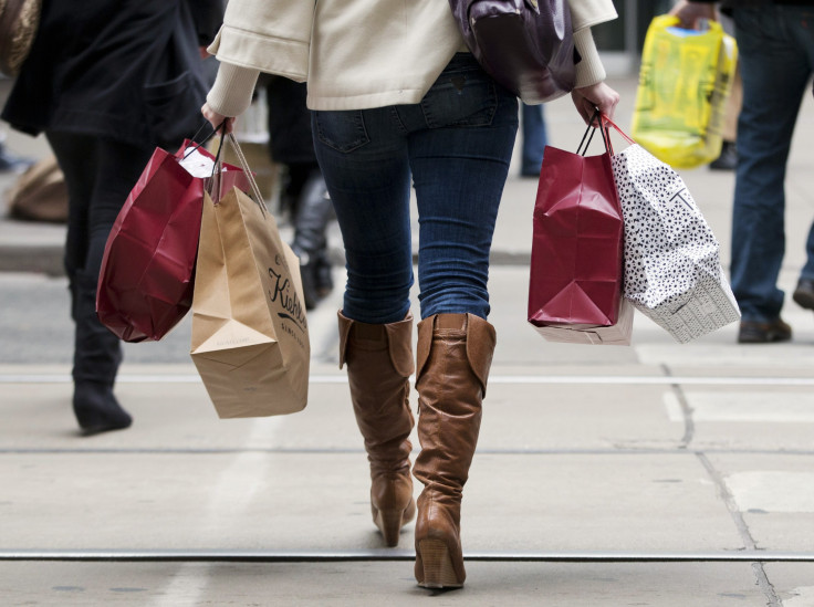 a woman carries shopping bags