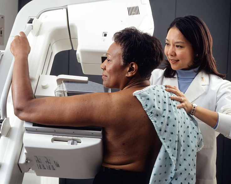 Woman receives mammogram.