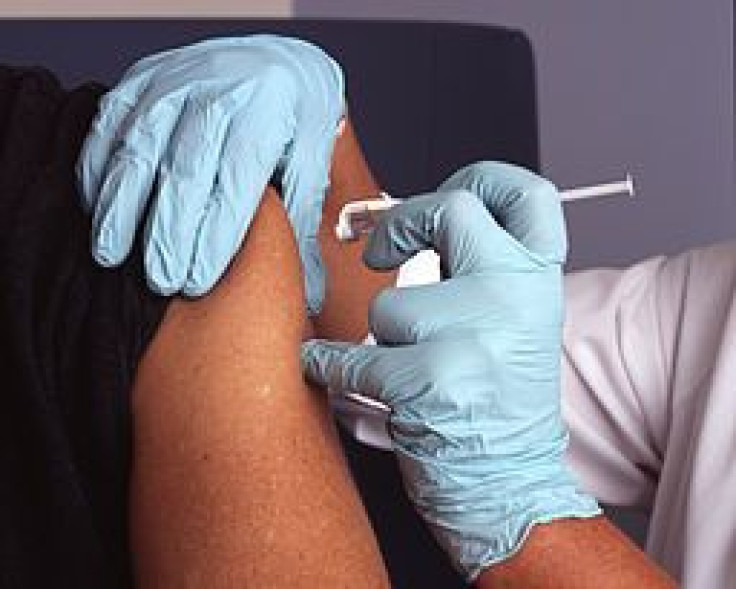 Nurse administers HPV vaccine to a boy