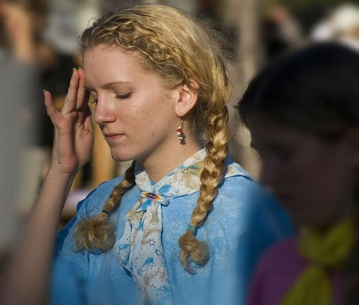 A woman experiencing a migraine.