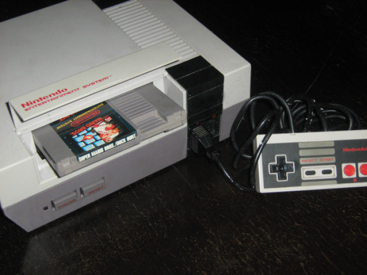 A NES console with the Super Mario Bros/Duck Hunt game