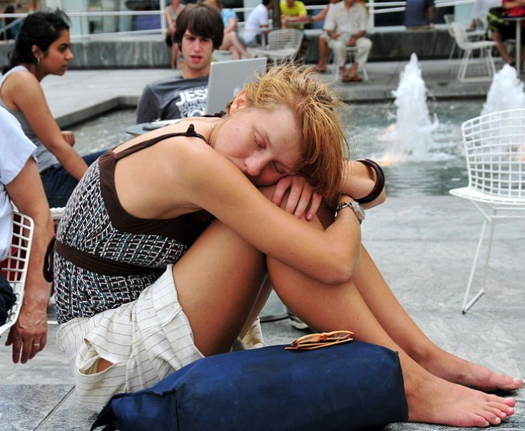 A woman sleeping in broad daylight.