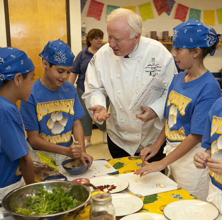 Children learning healthy eating habits from chef.
