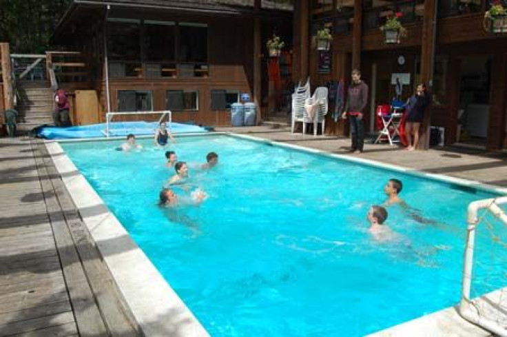 Kids swimming in pool.