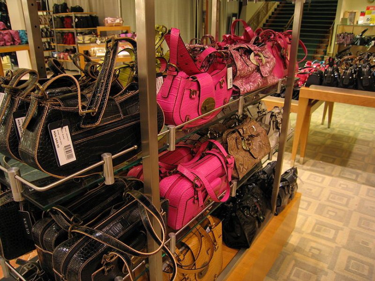 Leather handbags in store rack.