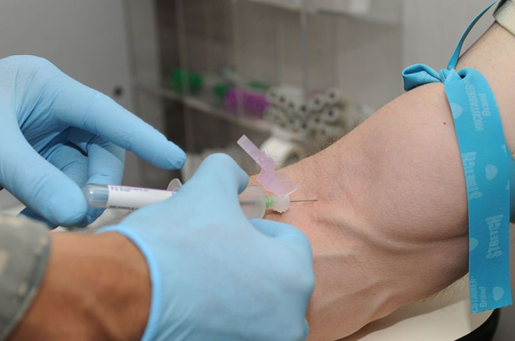 A blood donor gets blood drawn.