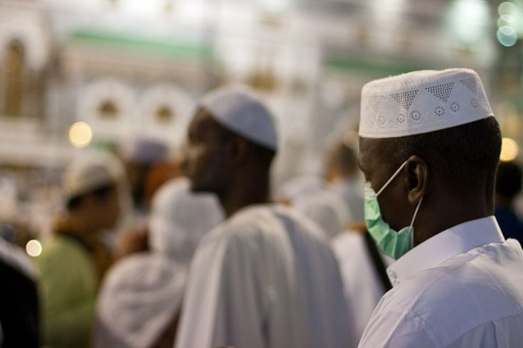 A pilgrim wears a mask at Mecca in 2009