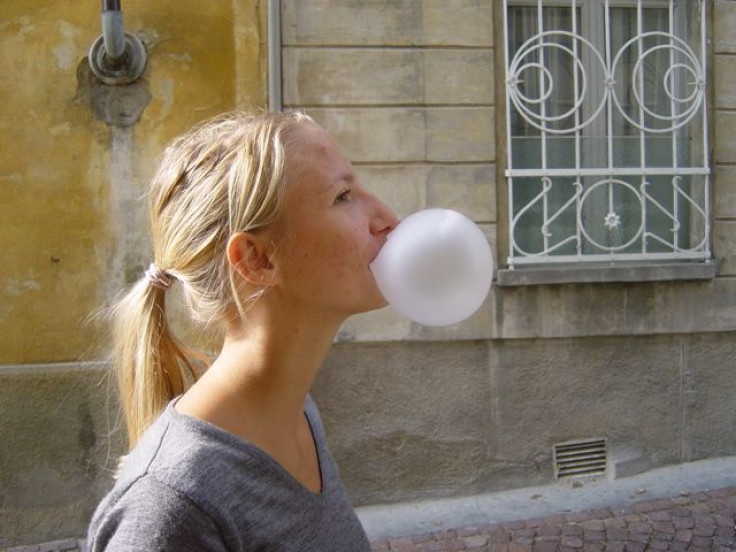 Woman blowing a bubble 