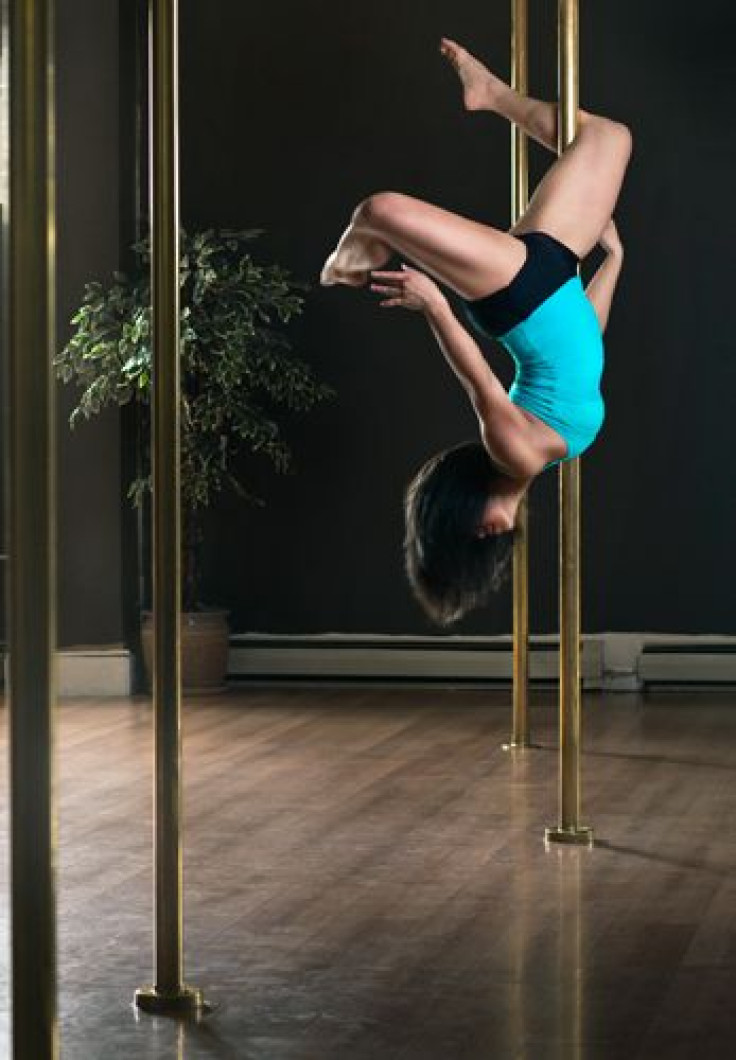 Woman doing pole dancing fitness