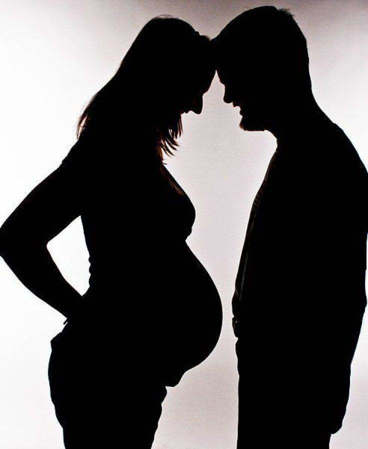 Silhouette of pregnant couple