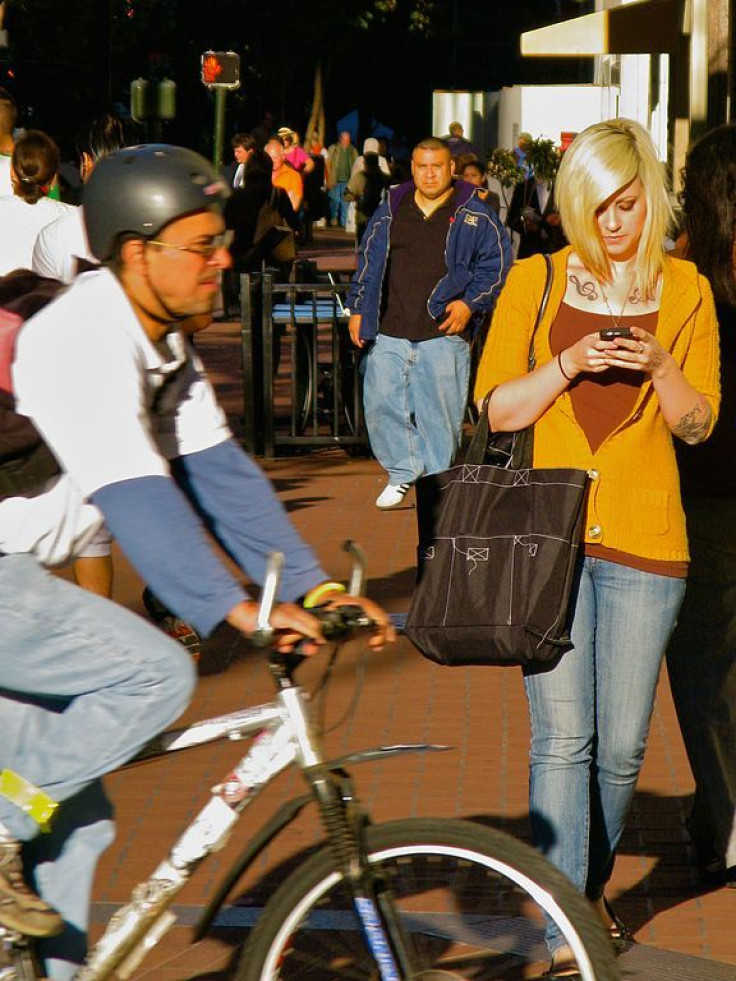 Student texting while walking 