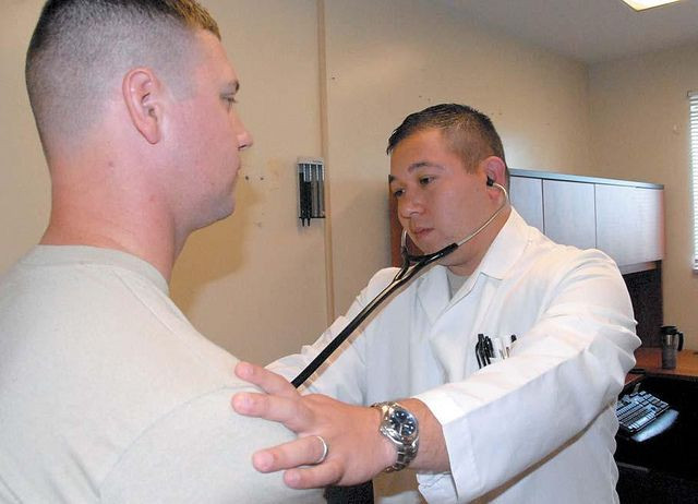 doctor checking heart