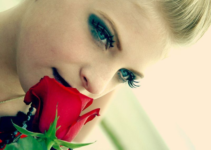 Woman smelling flowers