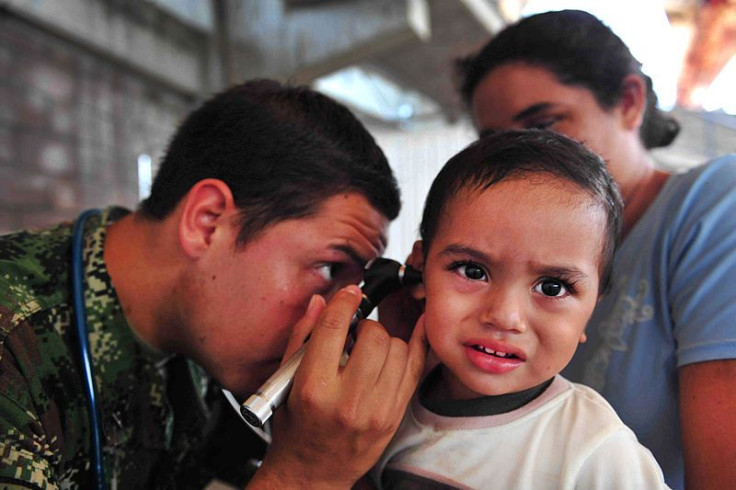 Child receiving ear examination 