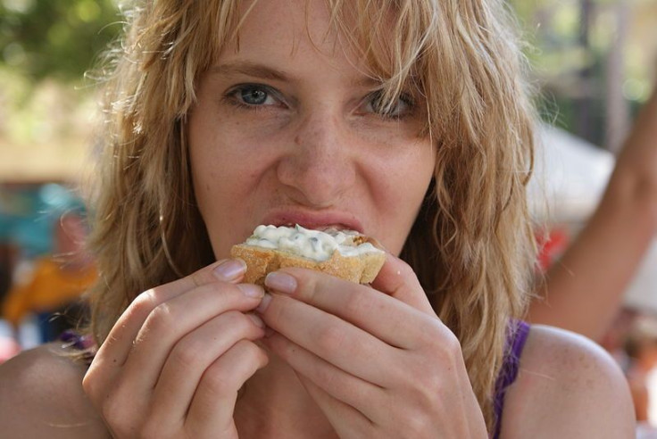 Woman eating bread
