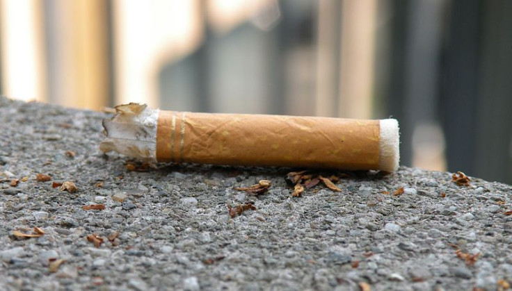 Cigarette on asphalt