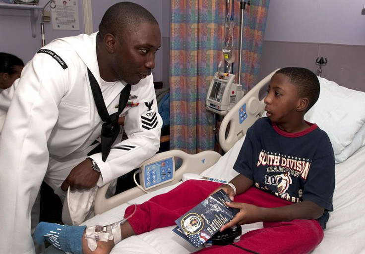 US Navy visiting boy in hospital
