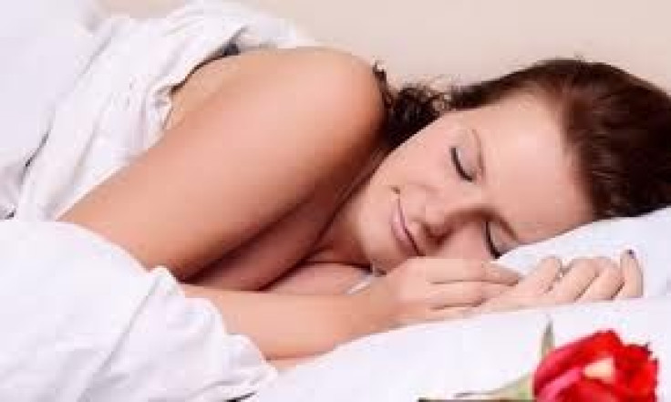 Woman sleeping on bed