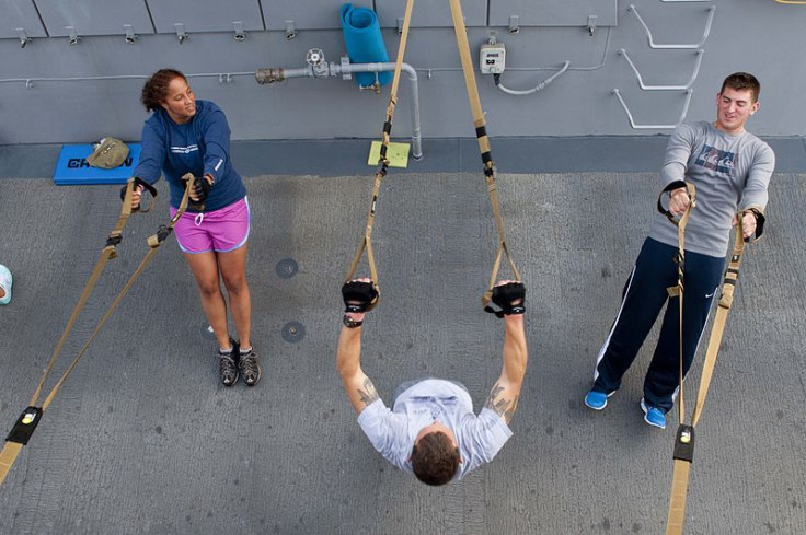 Sailors using workout resistance bands