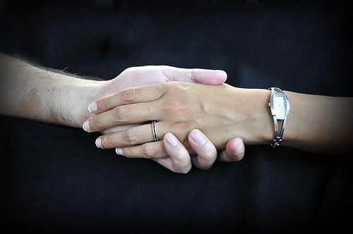 Couple holding hands
