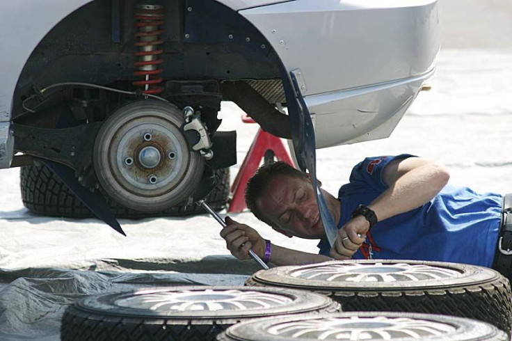 Auto mechanic fixing car