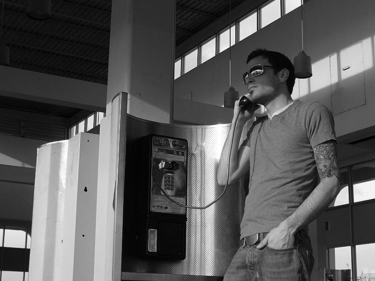 Man on payphone 