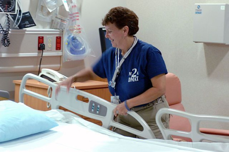 Nurse preparing bed